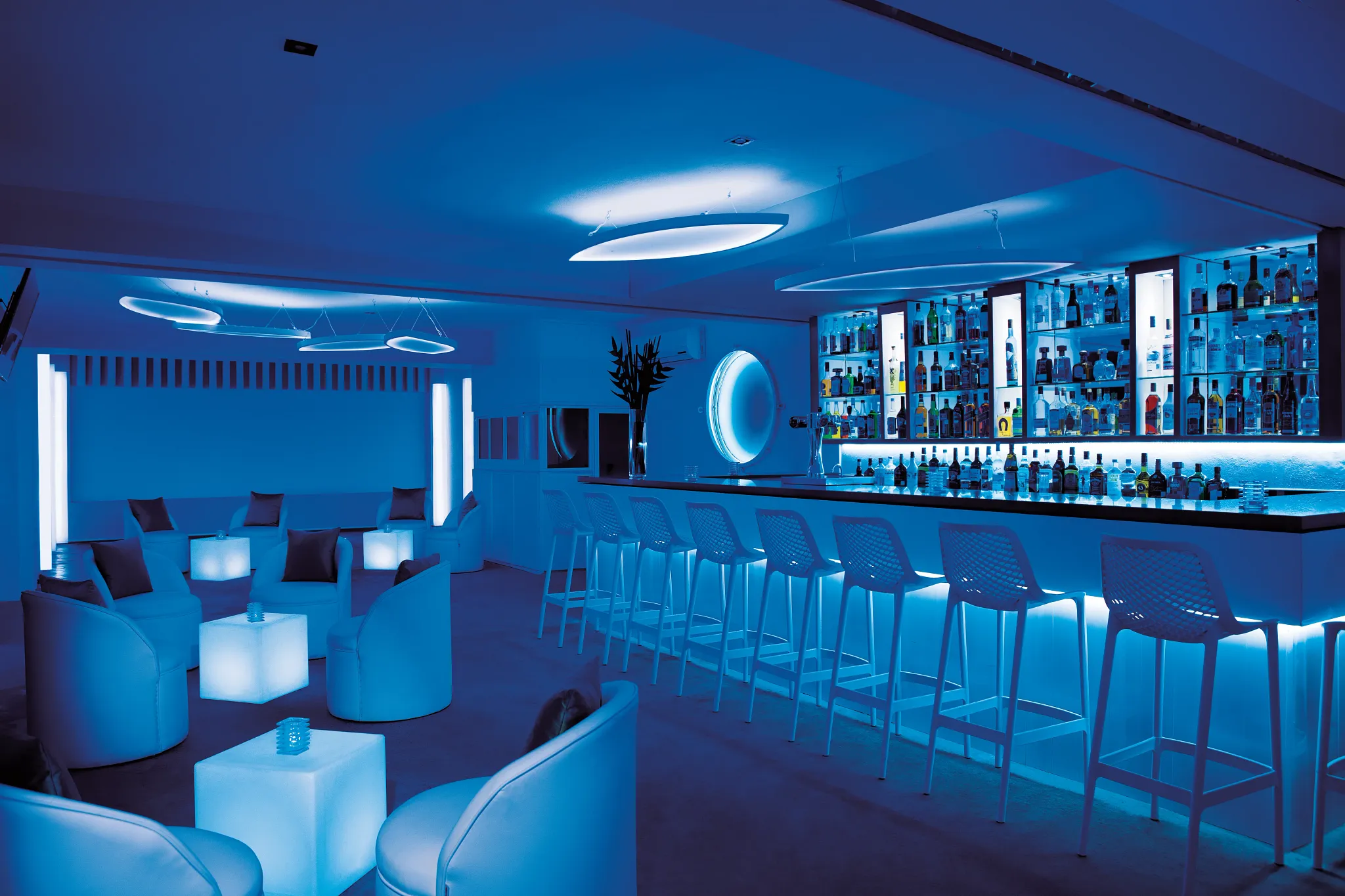 Desires Music Lounge Bar at Secrets Aura Cozumel featuring a stylish indoor lounge, ambient lighting, and lively late-night entertainment.