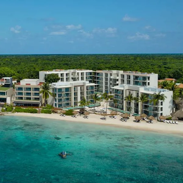 Dreams Cozumel Cape Resort and Spa family-friendly all-inclusive resort with tropical pools, beachfront access, and lush gardens on Cozumel Island Mexico.