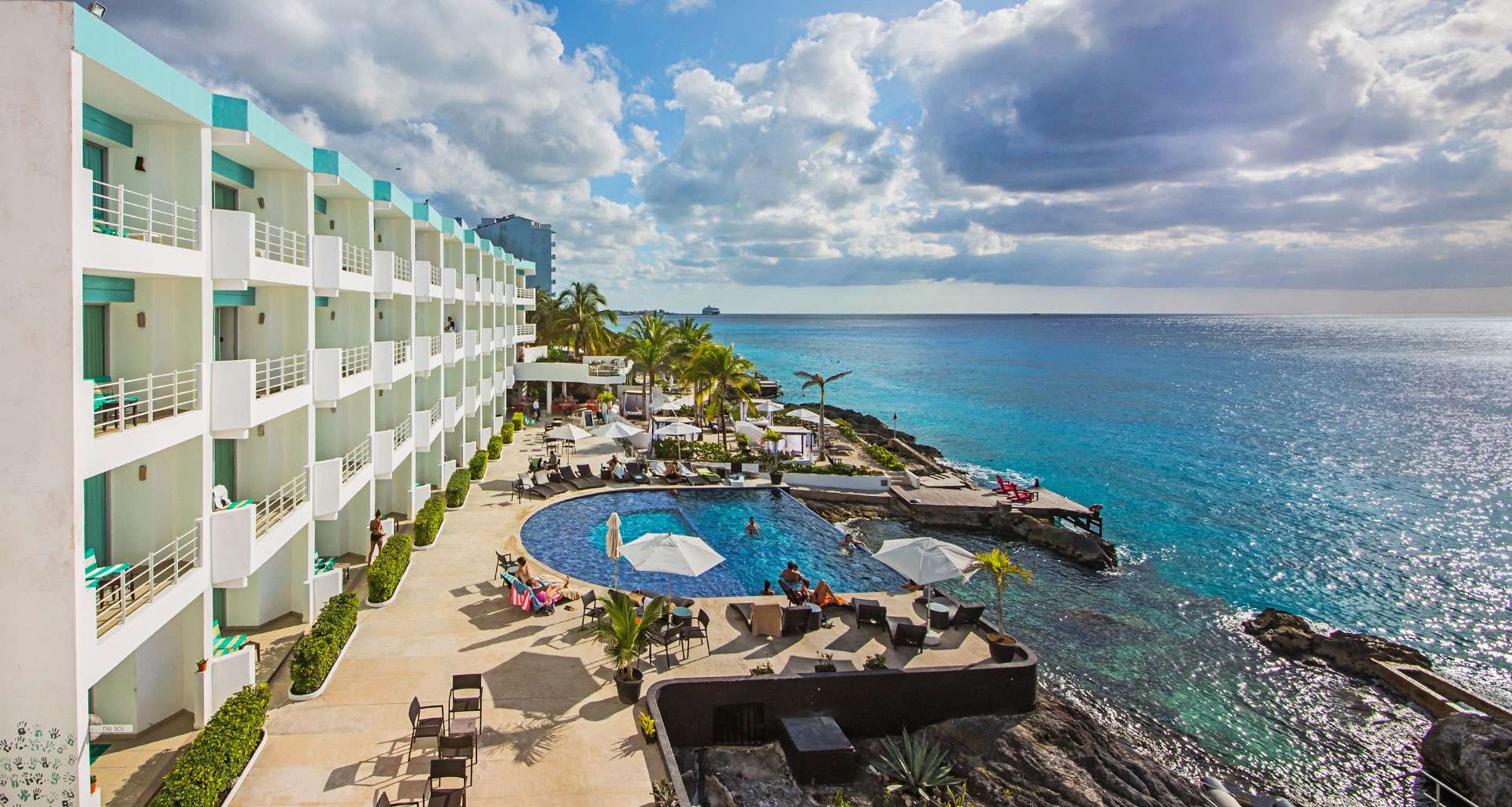 Hotel B Cozumel boutique hotel with oceanfront pool, modern design, and laid-back Caribbean atmosphere.
