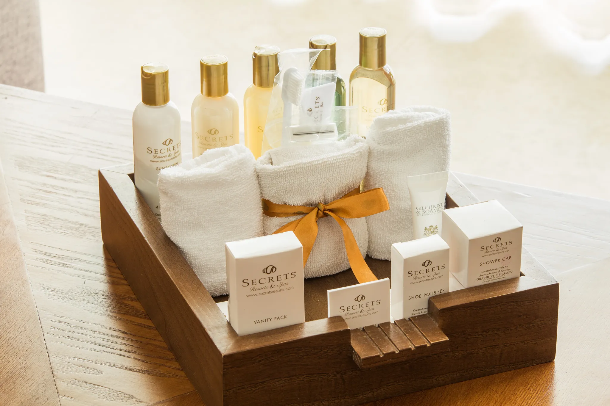 Luxury bath amenities and toiletries displayed in Junior Suite at Secrets Aura Cozumel.