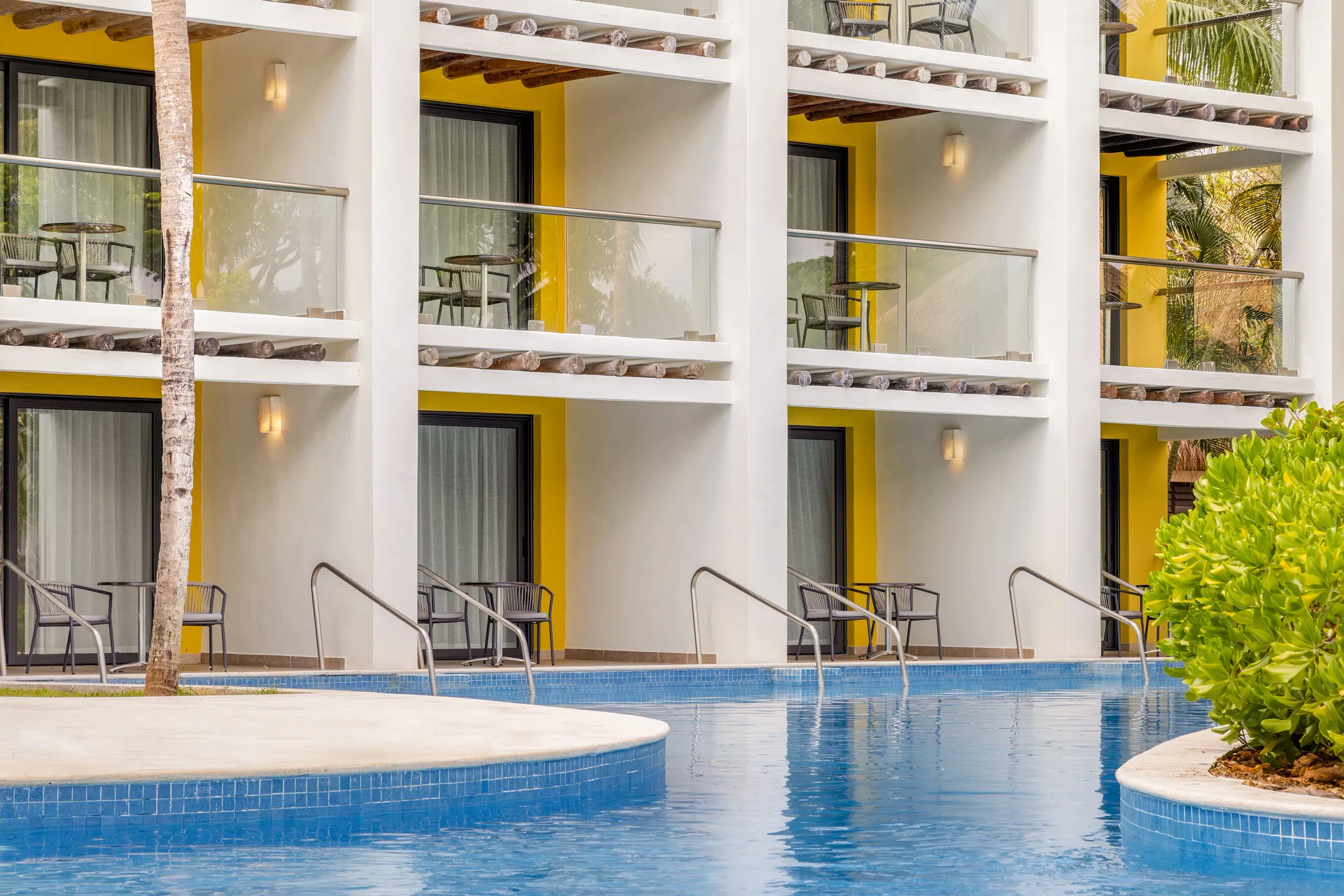 Swim-up pool outside Junior Suite with private terrace access at Secrets Aura Cozumel.