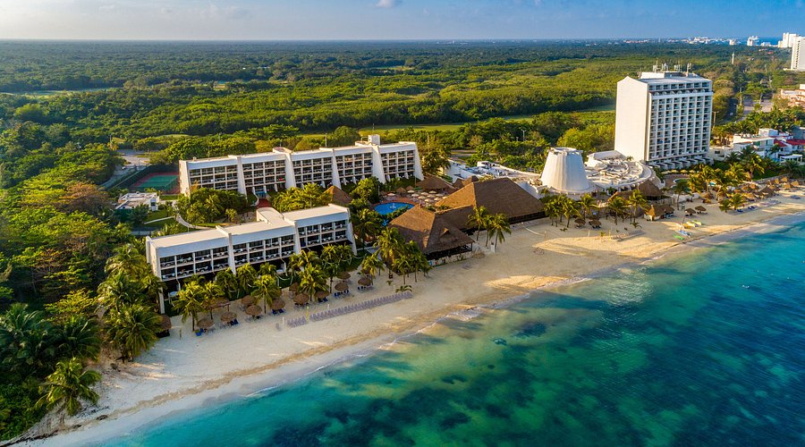Melia Cozumel all-inclusive resort with beachfront pools, tropical gardens, and ocean views in Cozumel.
