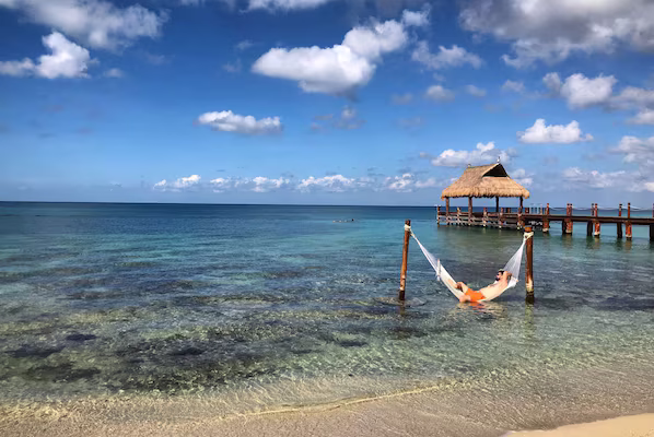 Paradise Beach near Secrets Aura Cozumel with white sand shores and clear turquoise Caribbean waters