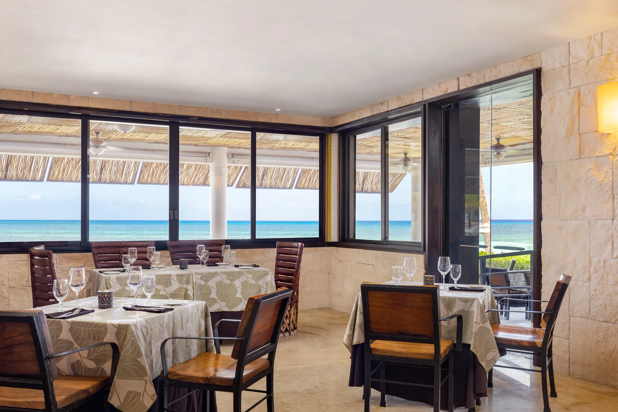 Windows Restaurant at Secrets Aura Cozumel featuring elegant dining, international cuisine, and an extensive fine wine cellar selection.